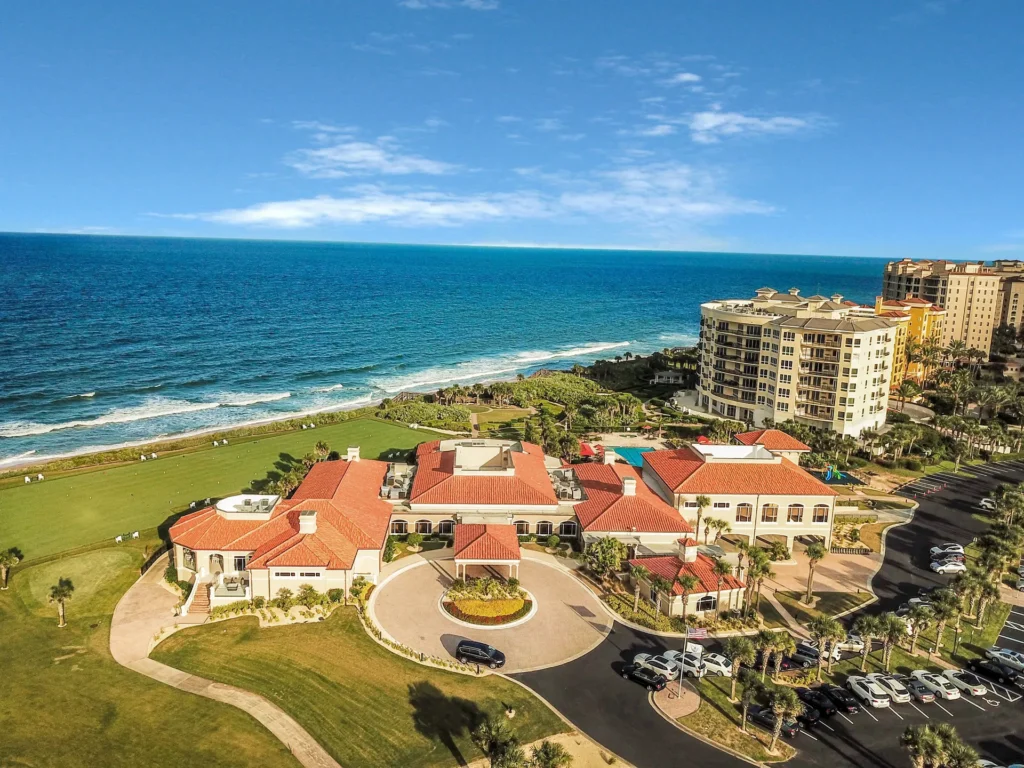 Hammock Dunes Club and Links Golf Course Aerial View 2- Drone footage of the Hammock Dunes clubhouse renovated by architect Ben Butera and aerial links golf course and ocean view.