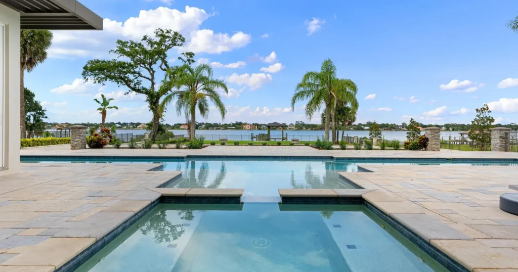 Waterfront pool, spa and private boat dock of top selling Florida home designed by Ormond Beach architect Benjamin P. Butera