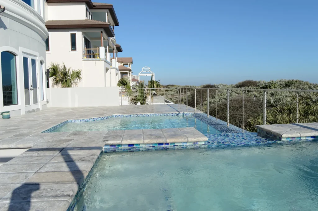 Luxury Custom Home Hammock Dunes Oceanfront Pool- Luxury pool and hot tub of an oceanfront custom home in Hammock Dunes golf club private community, designed by Ben Butera.