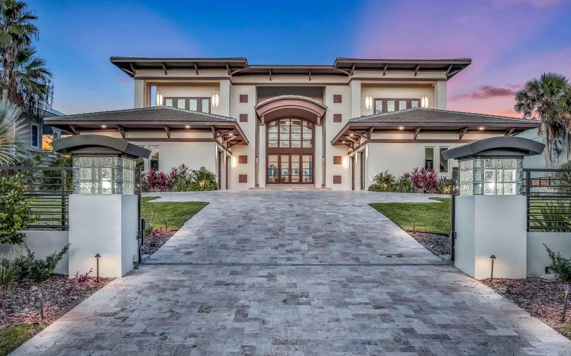 Custom-built home with symmetrical architecture and highest property value by Ben Butera, top Florida luxury home architect.