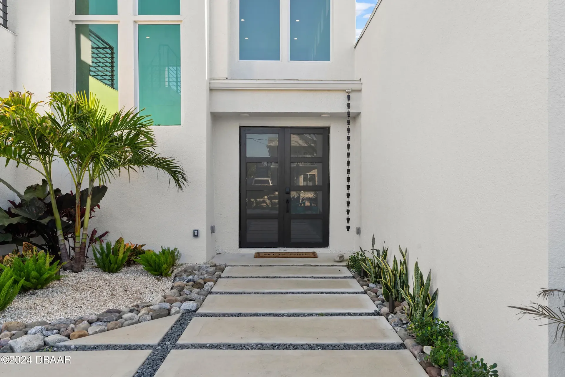 Sustainable contemporary custom home front door entrance designed by Benjamin P. Butera, the best architect near Palm Coast.