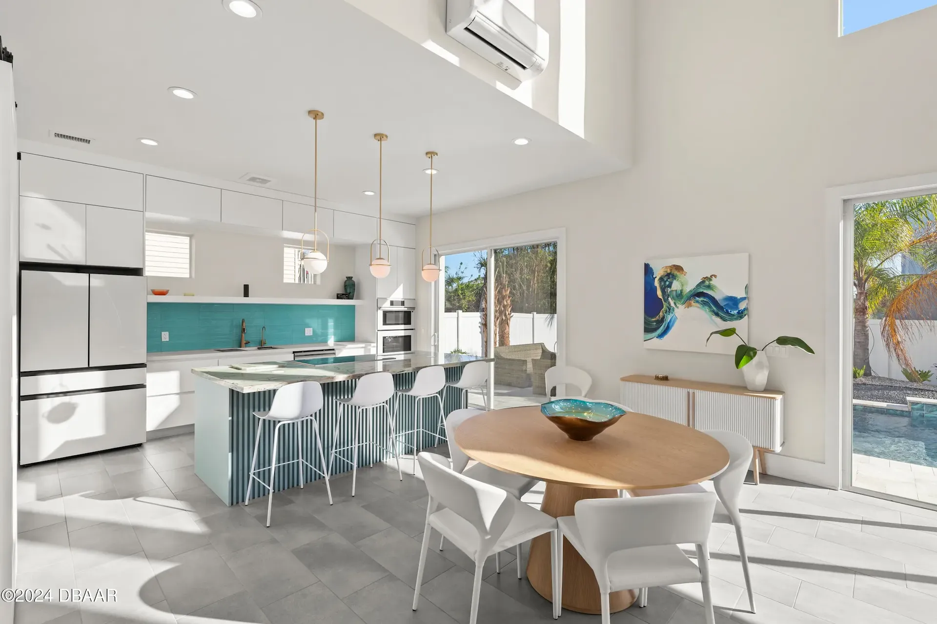 Sustainable contemporary custom kitchen with dining room and pool view by Benjamin P. Butera Florida home design studio.